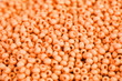 Lots beads orange color closeup background