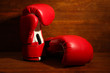 Boxing gloves on wooden background