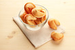 Fortune cookies in bowl, on wooden table