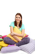 Photo: Beautiful young girl with pillows isolated on white. Beautiful young girl with pillows isolated on white.