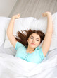 Photo: Beautiful young woman in bed Beautiful young woman in bed