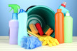 Cleaning items in bucket on  color background