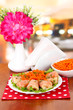 Stuffed cabbage rolls on table in cafe