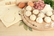Raw dumplings, ingredients and dough, on wooden table