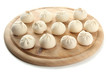 Photo: Raw khinkali on wooden desk, isolated on white Raw khinkali on wooden desk, isolated on white