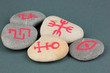 Fortune telling  with symbols on stones on grey background