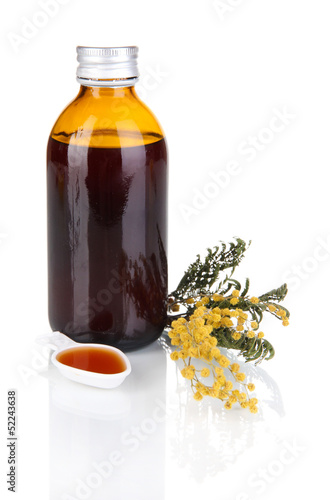 Photo: Cough syrup isolated on white Cough syrup isolated on white