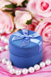 Rose and gift box on pink cloth