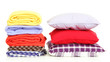 Photo: Bright pillows and plaids, isolated on white Bright pillows and plaids, isolated on white