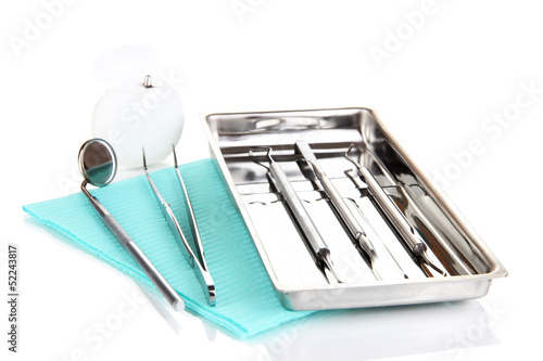 Photo: Dentist tools isolated on white Dentist tools isolated on white