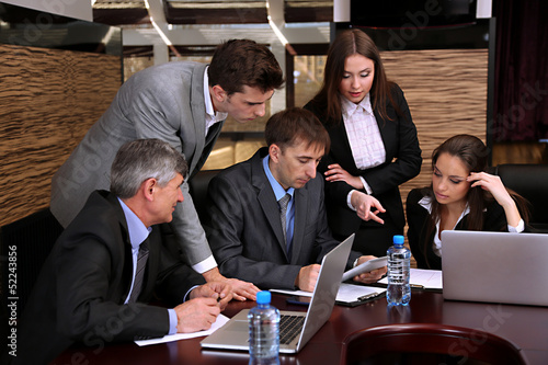 Photo: Business people working in conference room Business people working in conference room