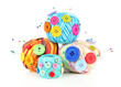 Colorful buttons and multicolor wool balls, isolated on white