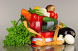 Fresh vegetables in scales on gray background