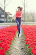 beauty young woman with flowers tulips