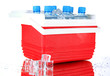 Traveling refrigerator with bottles of water and ice cubes,