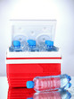 Traveling refrigerator with bottles of water and ice cubes,