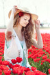 beauty young woman with flowers tulips