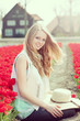beauty young woman with flowers tulips