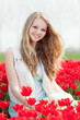 beauty young woman with flowers tulips