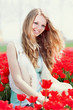 beauty young woman with flowers tulips