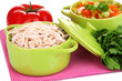 Shredded boiled chicken in green pan close up