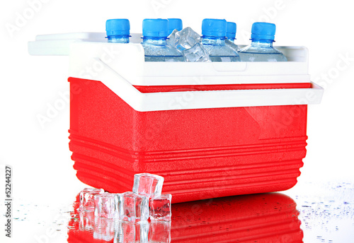 Photo: Traveling refrigerator with bottles of water and ice cubes, Traveling refrigerator with bottles of water and ice cubes,