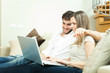 Photo: Couple using a notebook Couple using a notebook