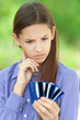 teenage girl shows credit card