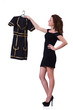 Woman trying to choose dress on white