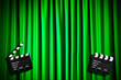 Movie clapper board against curtain