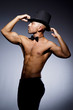 Muscular man in dark studio