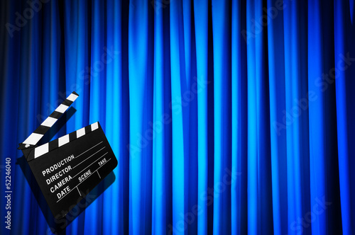 Photo: Movie clapper board against curtain Movie clapper board against curtain