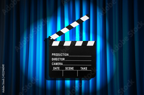 Photo: Movie clapper board against curtain Movie clapper board against curtain