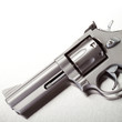 Handgun on brushed metal