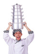Cook with stack of pots on white
