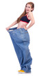 Woman in dieting concept with big jeans