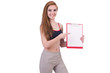 Young woman with notepad writing on white