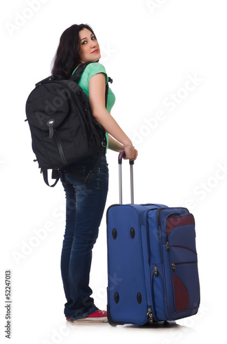 Photo: Young woman with suitcase isolated on white Young woman with suitcase isolated on white