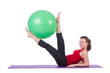 Young woman with ball exercising on white