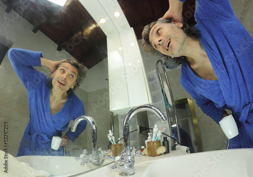 Photo: happy man in bathroom happy man in bathroom