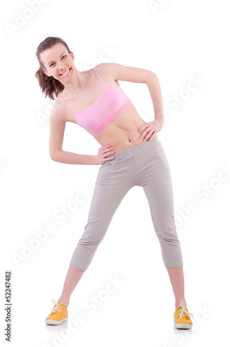 Photo: Young woman doing exercises on white Young woman doing exercises on white