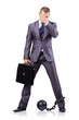 Businessman with shackles on white