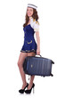 Woman travel attendant with suitcase on white