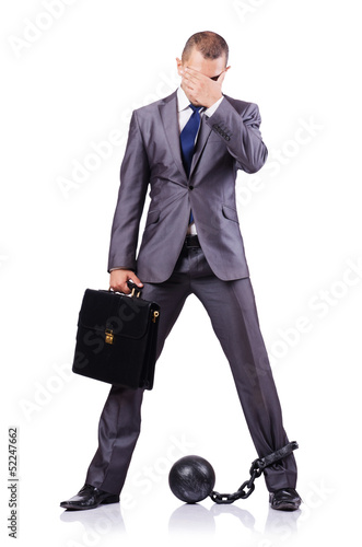 Photo: Businessman with shackles on white Businessman with shackles on white
