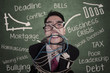 Close-up crazy businessman tied in cable and rope at class