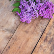 Fresh lilac on wooden background