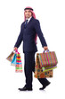 Arab man with shopping gifts on white