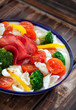 Gluten-free pasta with cherry tomatoes, broccoli and bresaola