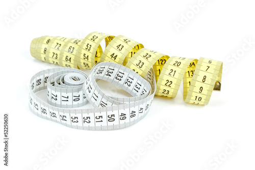 Photo: Yellow and white measuring tape isolated on white Yellow and white measuring tape isolated on white