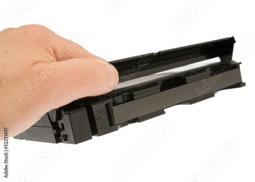 Photo: hand and videotape hand and videotape